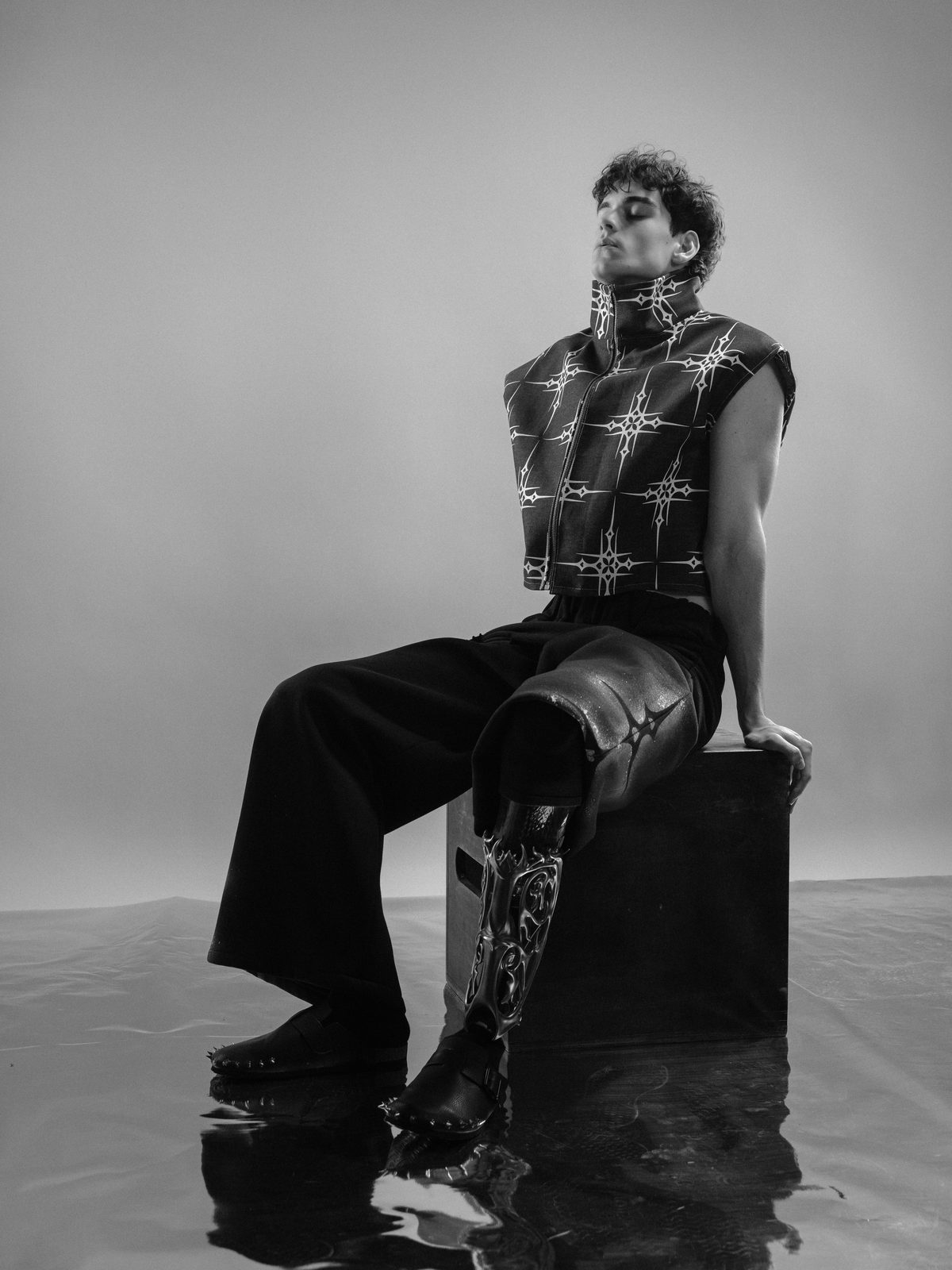 Jan Fonda seated in the studio, black and white